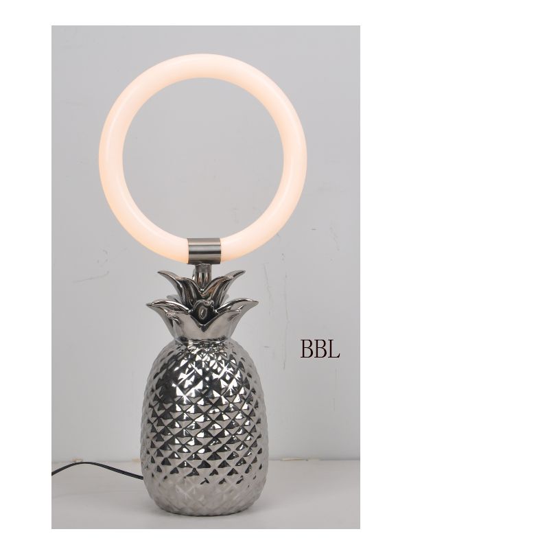 LED table lamp with ceramic pineapple lamp base and acrylic ring