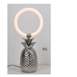 LED table lamp with ceramic pineapple lamp base and acrylic ring